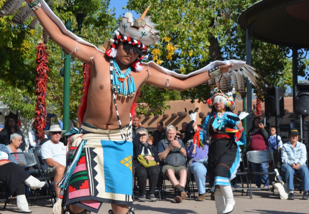 Image of Native American dancers performing in the Santa Fe plaza